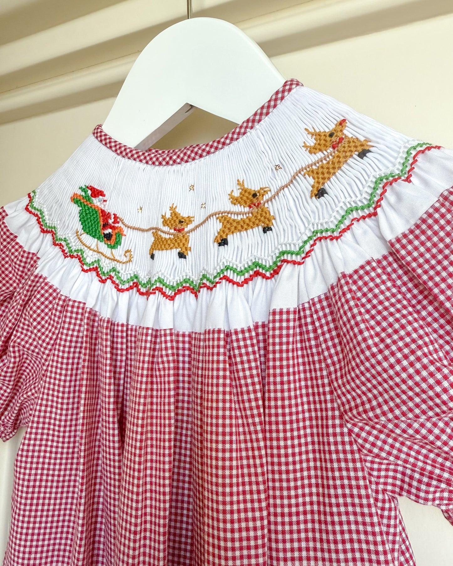 Flying Santa & Reindeer over Rooftop Smocked Bishop Dress